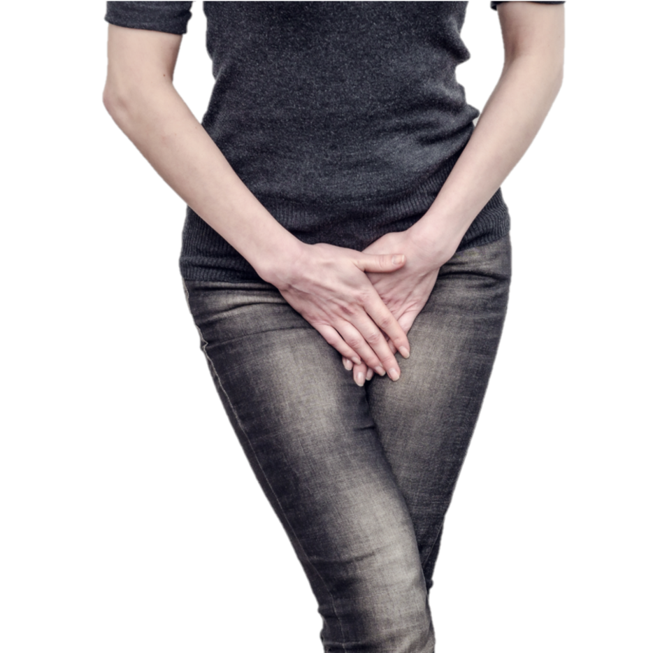 Female standing with legs crossed and both hands covering the pelvic area